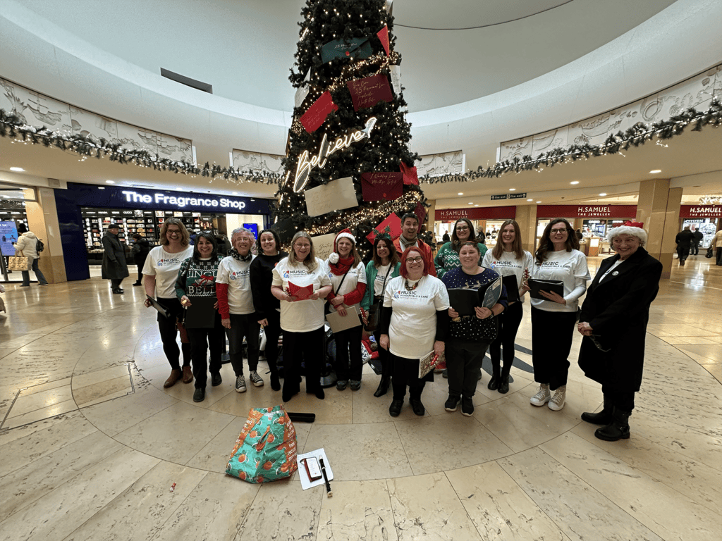 Companies House choir assembled under the Christmas tree at St David's Shopping Centre in Cardiff.