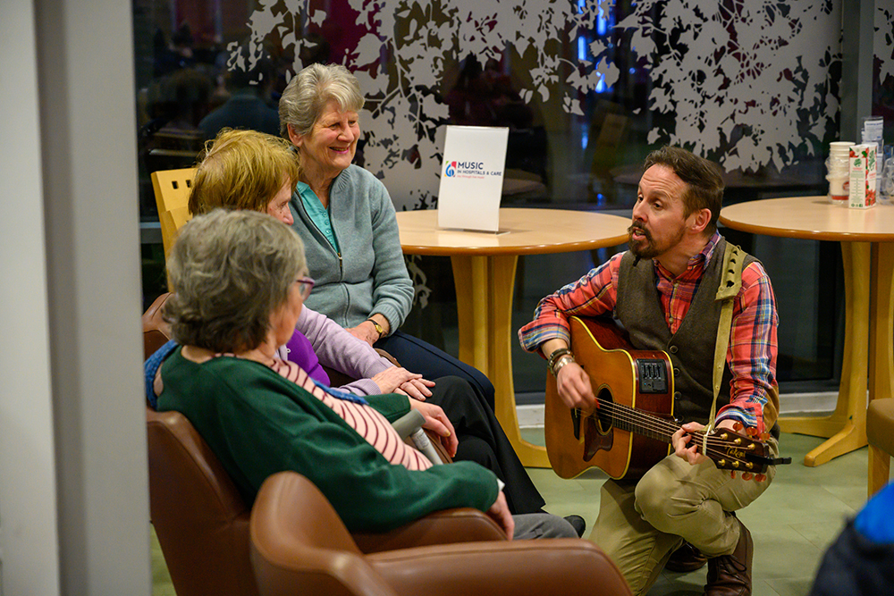 Musician playing to residents
